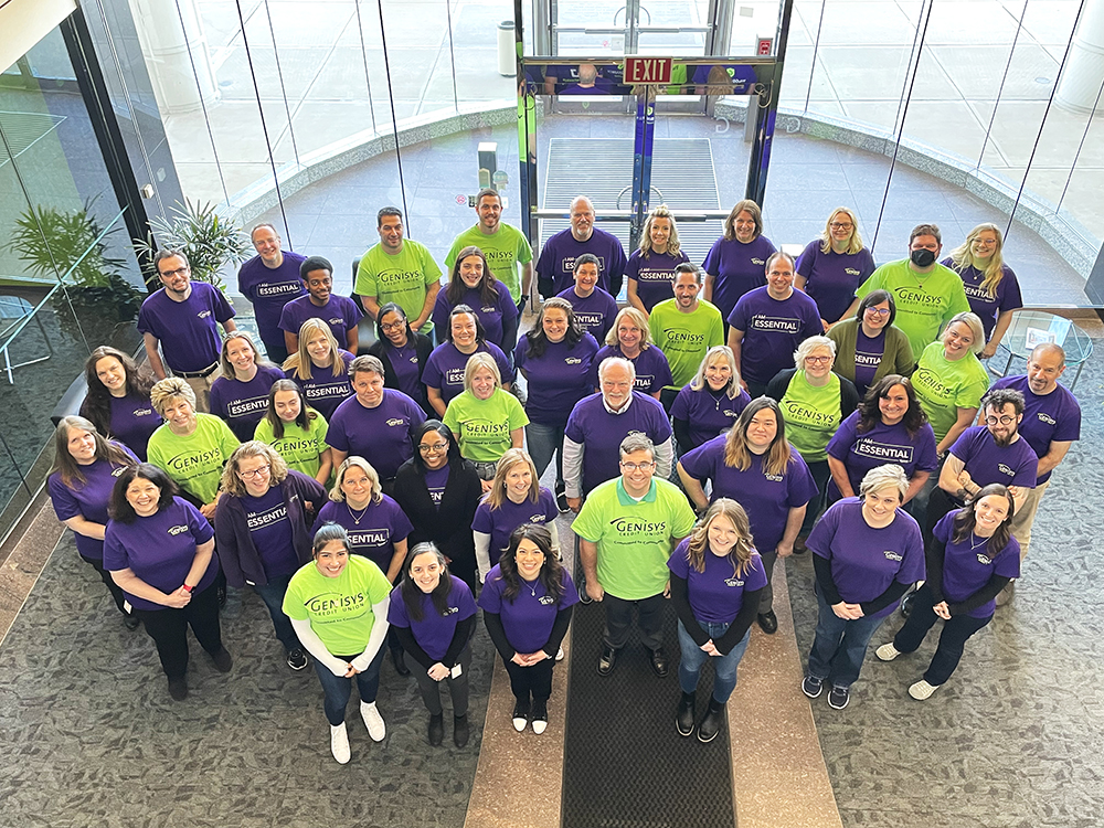 Genisys employees together in lobby